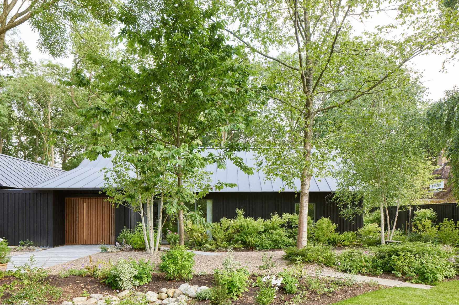 Green trees with a house behind