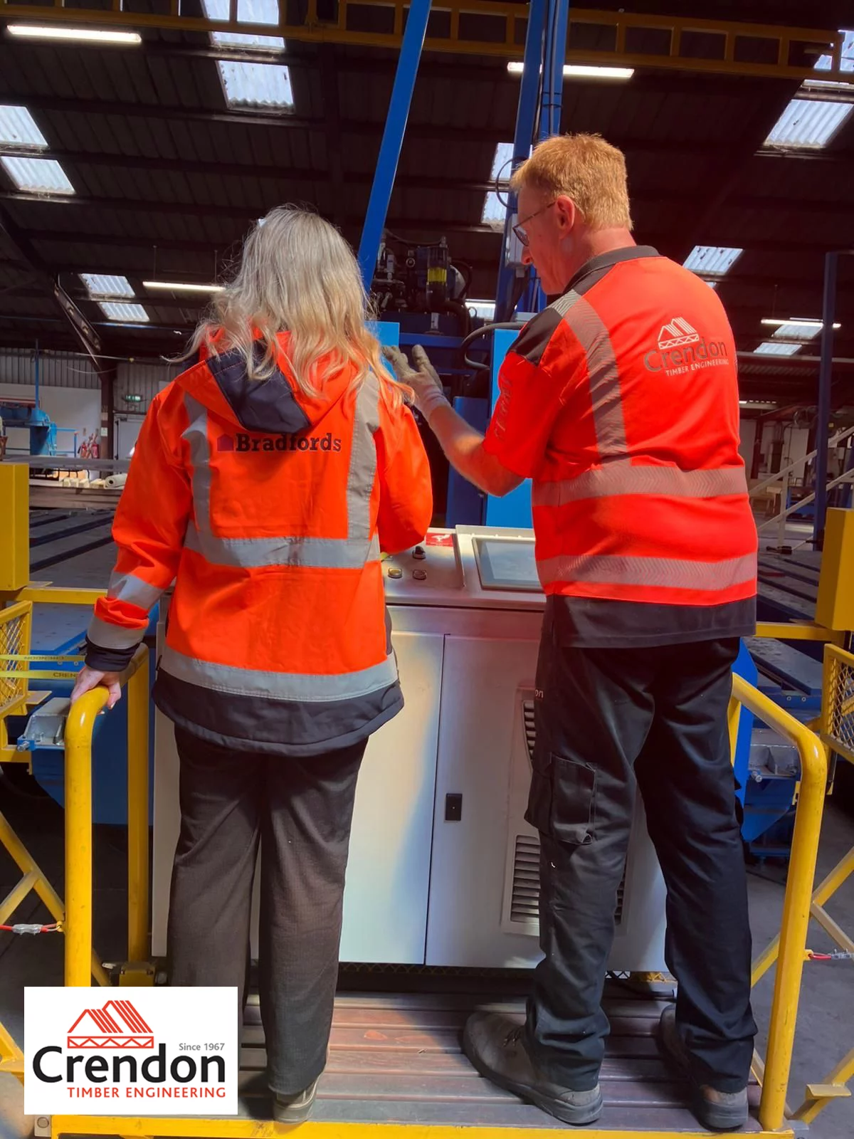 Two people operating machinery