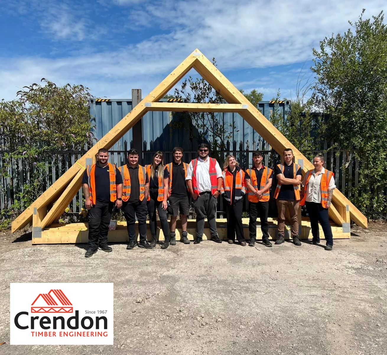 520309459_1312685490652375_3216010889421938049_n Group of people stood in front of attic roof truss