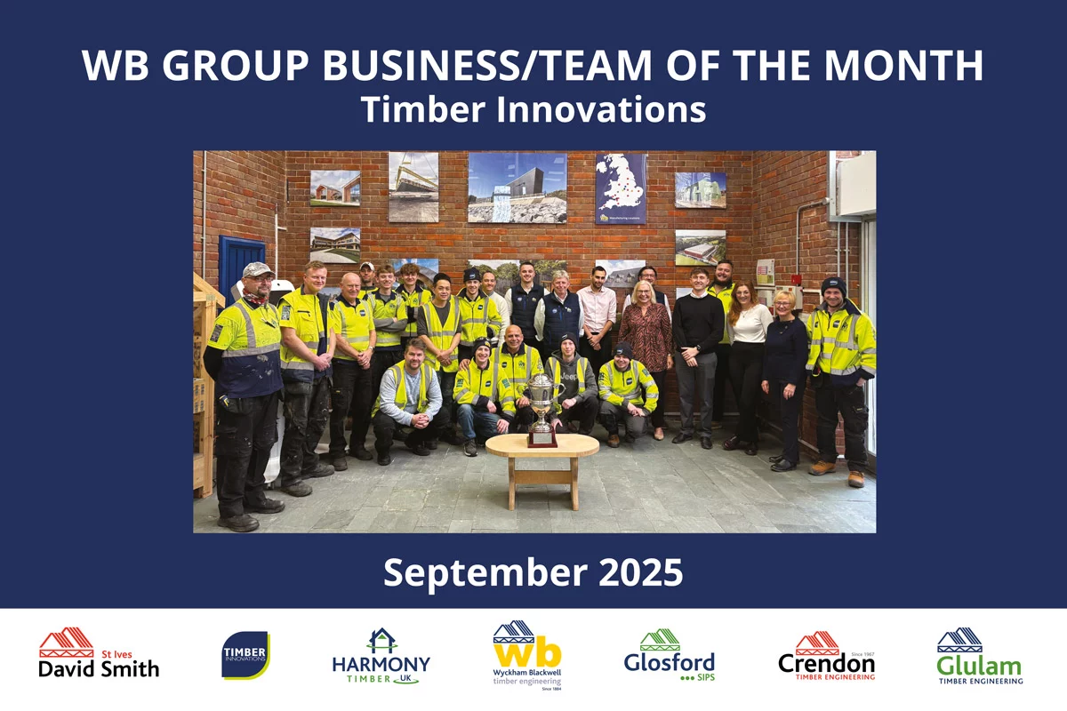 Group of people in high vis jackets posing for photo