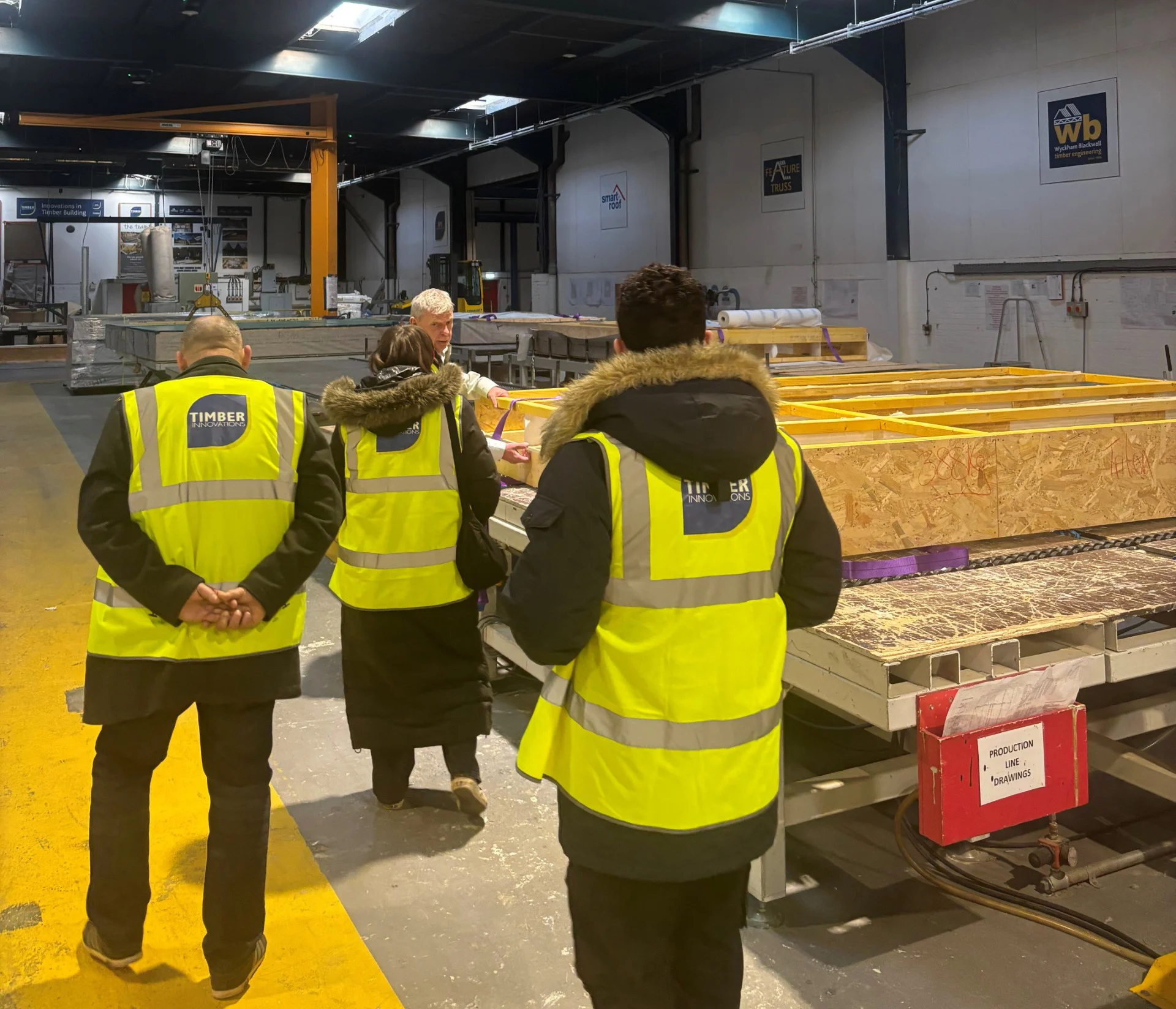 Attendees taking a tour of the TI factory.